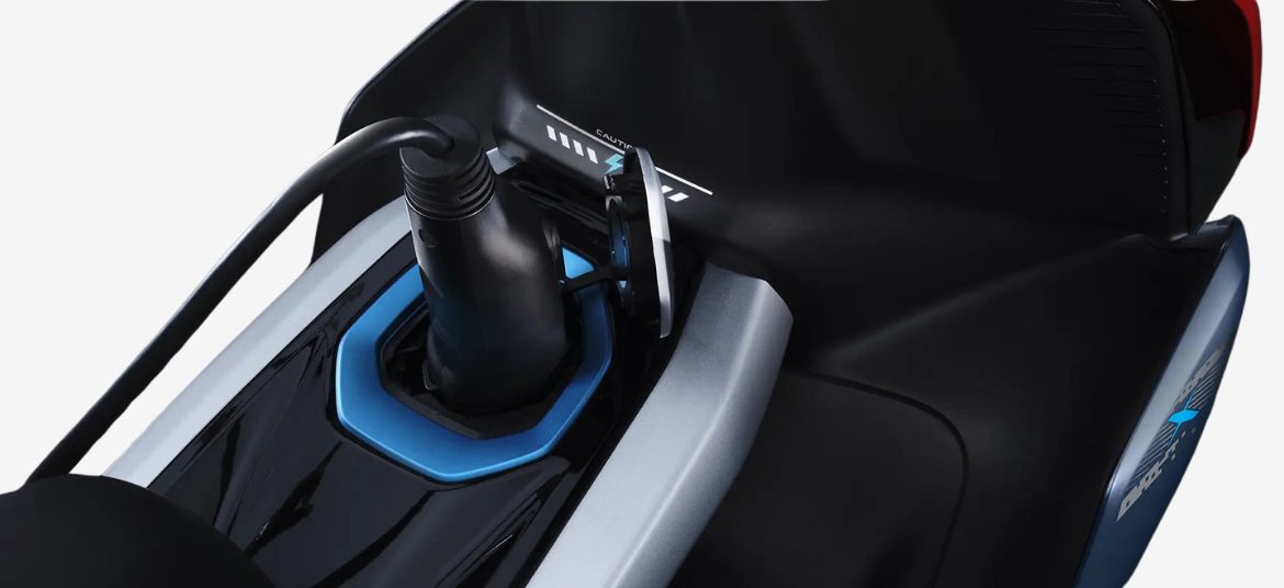 TVS X electric scooter charging port close-up