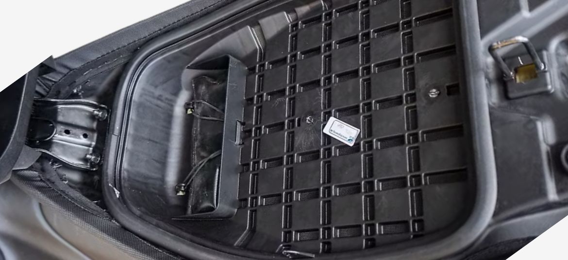 Bajaj Chetak C2501 electric scooter seat upside down image with toolkit storage section