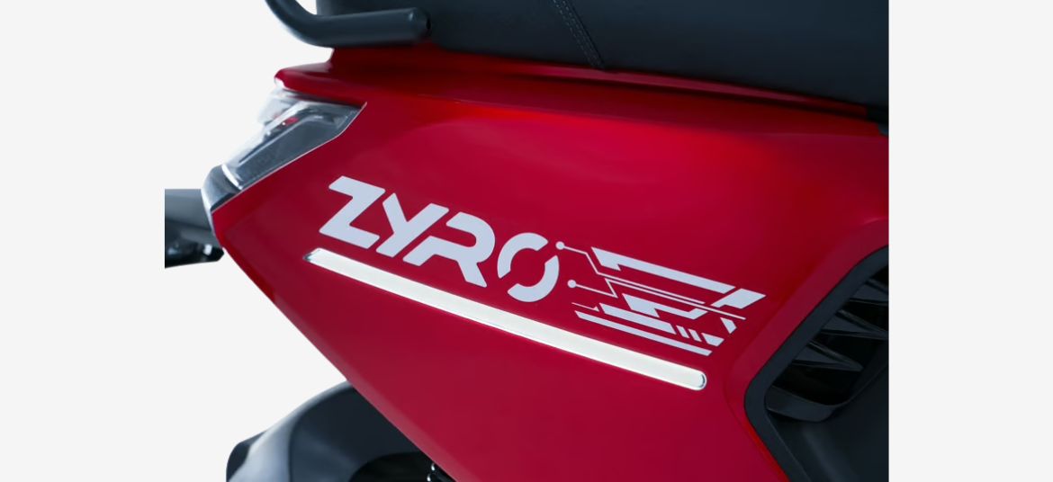 Lectrix ZYRO LA 48V branding logo on red body panel of electric scooter