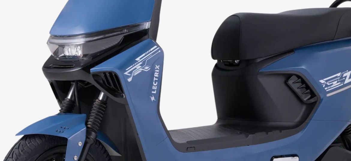 Lectrix ZYRO LA 48V blue electric scooter front section close up with LED headlamp, front suspension and textured floorboard